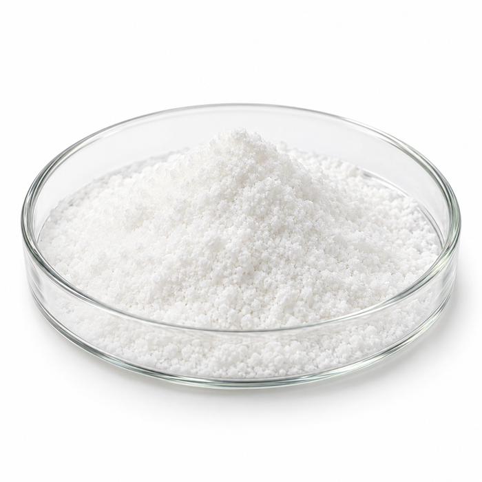 White crystalline 4-Butylresorcinol powder in a clear Petri dish on white