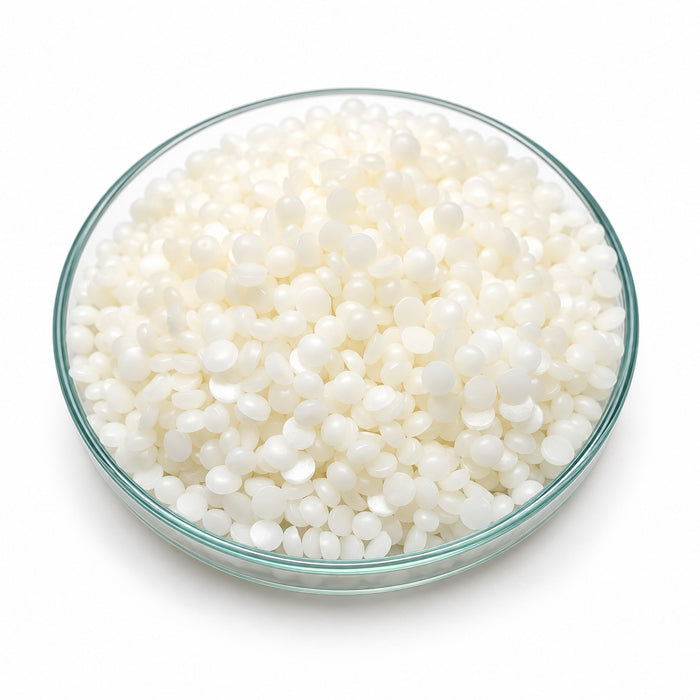 Montanov 202 natural O/W emulsifier wax pastilles in a glass petri dish – SEPPIC, COSMOS approved