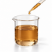 Amber-brown Pentavitin liquid in a glass laboratory beaker with a pipette on white