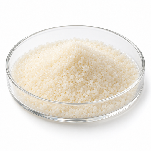 Fine ivory Span 60 sorbitan stearate grains in a clear glass Petri dish on white