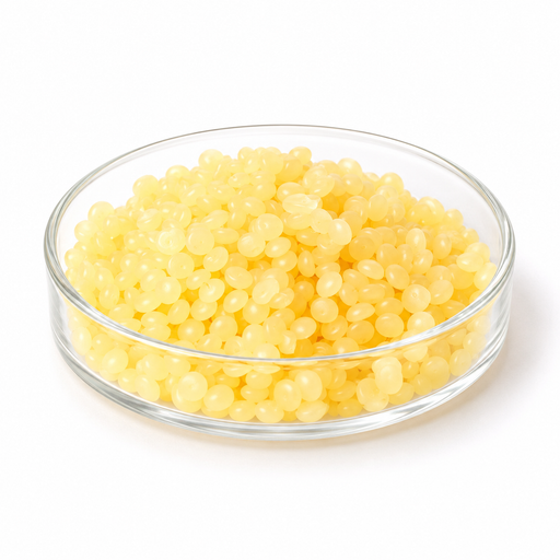 Pale yellow TEGO Care PBS 6 emulsifier pastilles in a clear glass Petri dish on white